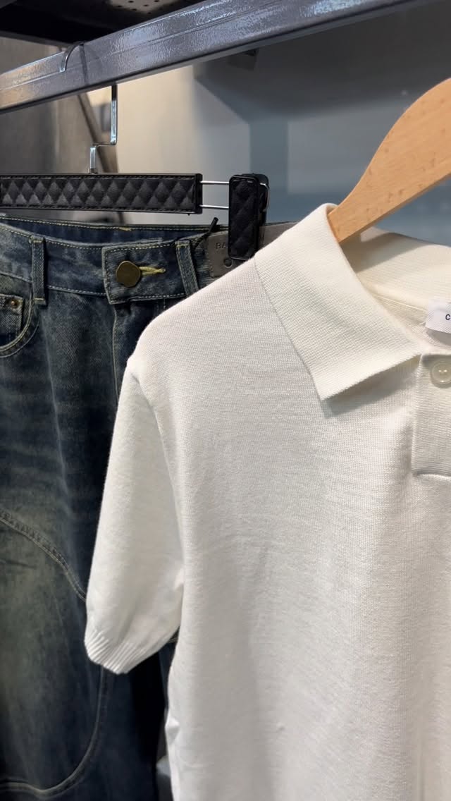A knit polo and washed denim in the shop